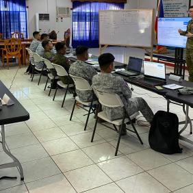 A Royal Australian Air Force engineer presents to Armed Forces of the Philippines servicemembers during an Airfield Survey and Airfield Repair Mobile Training Team as part of Joint Australian Training Team - Philippines program.
