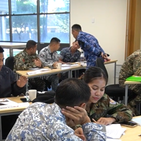 Major Zaky from the Indonesian Air Force monitors students duirng a filmed lesson with the Pre Intermediate English course at the Defence International Training Centre.
