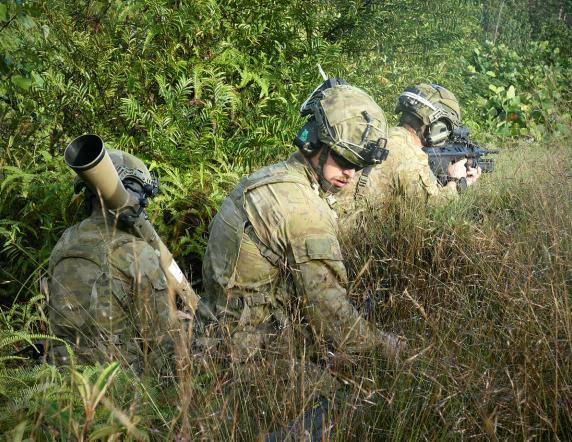 soldiers in the jungle with weapons