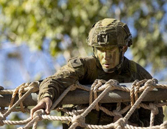 Australian Army Corporal Dylan Smith from the 3rd Battalion, The Royal Australian Regiment, takes part in the obstacle course as part of the Commander's Trophy competition at Lavarack Barracks, Queensland, on 20 August 2021.