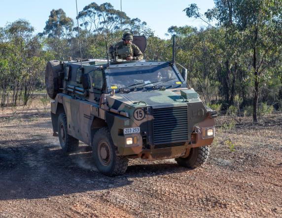 A Bushmaster Protected Mobility Vehicle manoeuvres between positions during Exercise Rhoden Strike at Puckapunyal Military Area on 17 November, 2023.