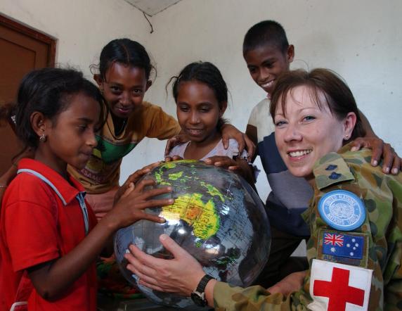 Army Reservist, Lieutenant Rachuel Manning, shows children the world is theirs after a health clinic held in the Bobonaro district of East Timor. The Hobart based nurse is a member of the Royal Australian Army Nursing Corps who along with the Royal Australian Army Medical Corps are celebrating a hundred years of service this year. 