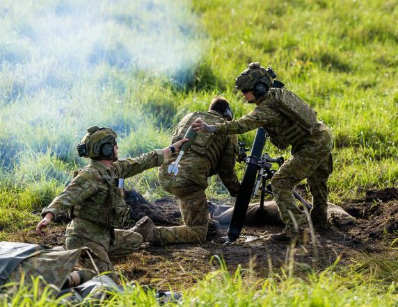 Australian Army soldiers from the Joint Australian Training Team – Philippines, fire the 81mm mortar during an all arms call for fire serial to qualify Philippine Army personnel.