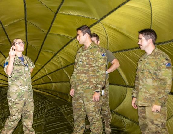 Royal New Zealand Air Force officer Air Commodore Susie Barnes, Deputy Air Commander for Australia, chats with Australian Army soldiers from 176th Air Dispatch Squadron during her visit to RAAF Base Richmond, New South Wales.