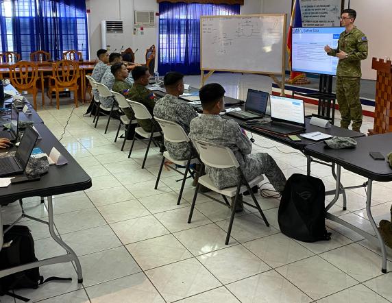 A Royal Australian Air Force engineer presents to Armed Forces of the Philippines servicemembers during an Airfield Survey and Airfield Repair Mobile Training Team as part of Joint Australian Training Team - Philippines program.