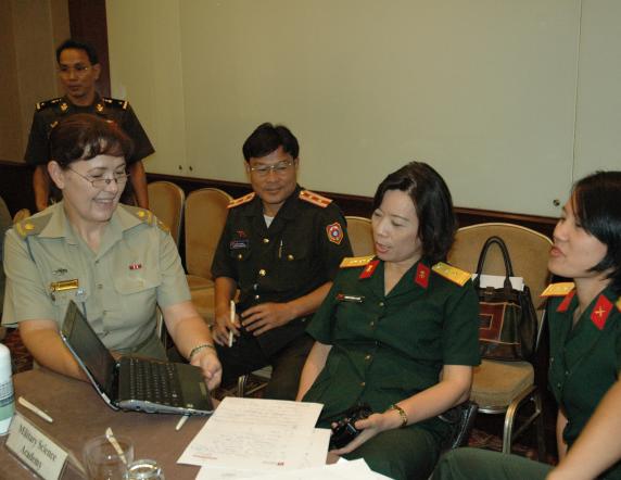 MAJ Linda Birchley (Australian Language Advisor - Vietnam/Laos) working with the Vietnamese People's Army delegation at the Regional English Language Schools conference in Hanoi last week. Mid caption: Defence is enhancing Australia’s relationships with South East Asia and the South Pacific by providing training to foreign militaries, including teaching English. Schools that work with the ADF to provide the language training gathered in Hanoi, Vietnam from 29 to 31 May for the Regional English Language Scho