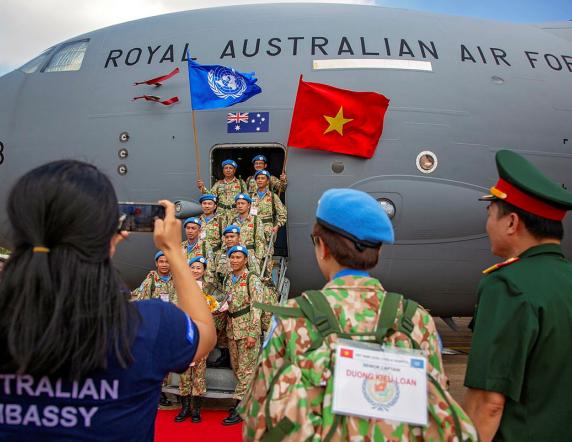 Vietnam People's Army peacekeepers from the Level Two Field Hospital contingent - Rotation Five, on the steps of a Royal Australian Air Force C-17A Globemaster, during a farewell ceremony held in honour of their departure from Ho Chi Minh City, Vietnam, to South Sudan in Northern Africa.