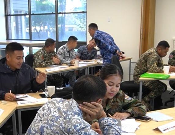 Major Zaky from the Indonesian Air Force monitors students duirng a filmed lesson with the Pre Intermediate English course at the Defence International Training Centre.