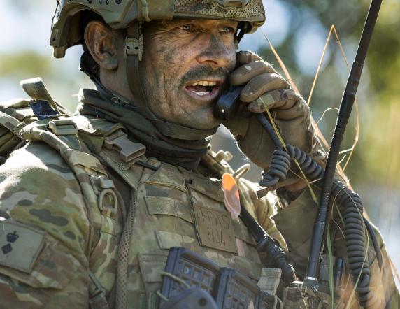 Commanding Officer 2nd Battalion, Royal Australian Regiment, Lieutenant Colonel Douglas Pashley, CSC, speaks on his radio during a contact at Shoalwater Bay Training Area in North Queensland as part of Exercise Talisman Saber 17.