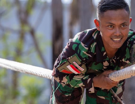 A soldier from the Indonesian national Armed Forces conducts an obstacle during an obstacle course run through, in Robertson Barracks, Darwin, Northern Territory.