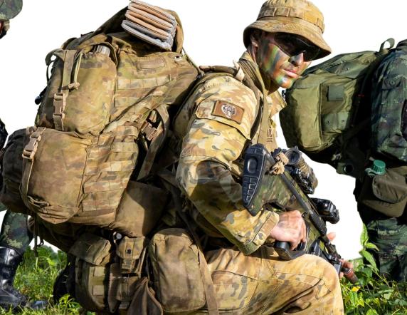 Thai and Australian soldiers carry their tactical field kit on a patrol during Exercise Chapel Gold.